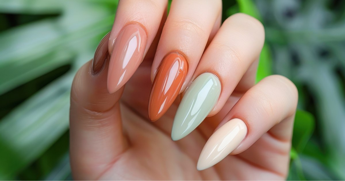 Fall manicure in peach, terracotta, sage green, and cream shades